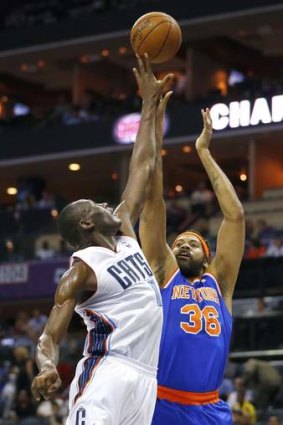New York Knicks power forward Rasheed Wallace has a shot blocked during a NBA game against Charlotte Bobcats.