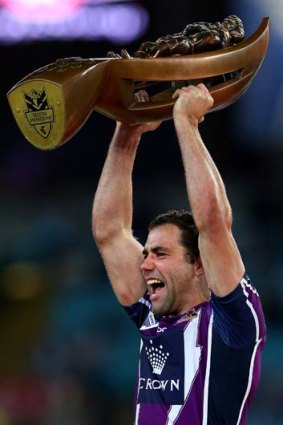 Storm skipper Cameron Smith holds aloft the premiership trophy after the Storm defeated the Canterbury Bulldogs in the grand final in September.