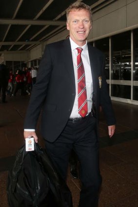 Manager David Moyes is seen upon arrival at Sydney International Airport.