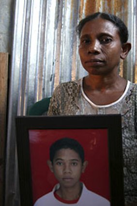 East Timor refugee Maria Martins holds a picture of her dead son, Honorio.