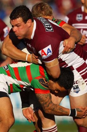 The momentum of Jason King of the Sea Eagles is brought to a sudden halt.