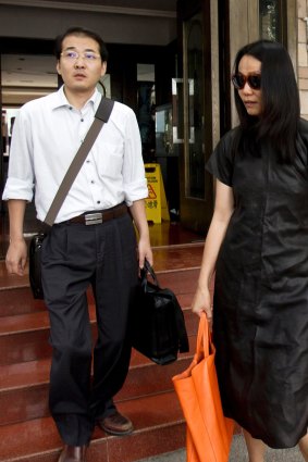 Lawyer Xia Lin, left, walks with Lu Qing, wife of outspoken Chinese artist Ai Weiwei. Xia's prison sentence is the latest in a string of convictions of Chinese lawyers who have been engaged in human rights cases.