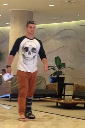 Moon-boot walking: Greg Bird hobbles through the foyer of the Crowne Plaza at Coogee.