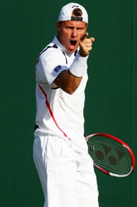 Cop that ... Lleyton Hewitt progresses to the next round of Wimbledon despite an ongoing ankle injury.