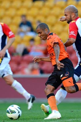 Serginho Van Dijk of Adelaide was penalised for this tackle on Henrique of the Roar.