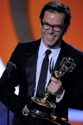 Guy Pearce accepts the award for outstanding supporting actor in a Miniseries or a Movie for <i>Mildred Pierce</i>.