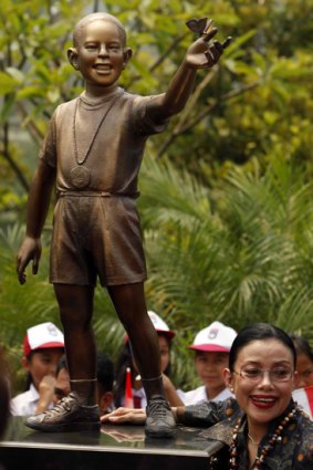 A bronze statue of a young Barack Obama at Menteng Park in Jakarta.