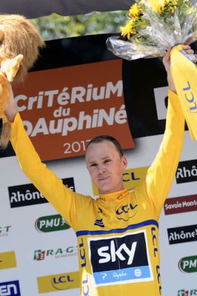 Britain's Christopher Froome celebrates on the podium.