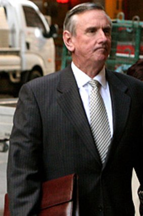 Just put it on the card ... Geoffrey Smith arrives at the ICAC hearing yesterday, after the lunch break.