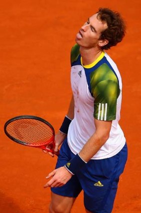 Andy Murray reacts after a point during his second-round match against Marcel Granollers of Spain.