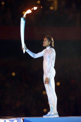 Cathy Freeman in the white bodysuit, which was stolen after the opening ceremony.