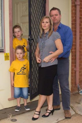 Alarmed ... police officer Tony Wood and his family, whose Nyngan home was contaminated.