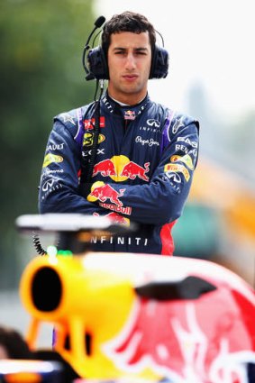 Australian driver Daniel Ricciardo watches the team practise pitstops in Bahrain.