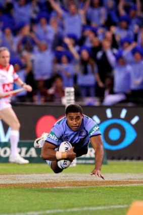 NSW's Michael Jennings scores a try.