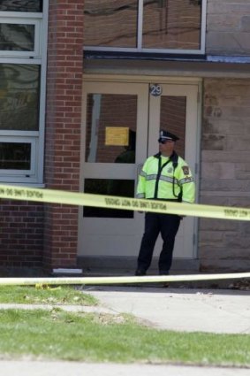 Active crime scene ... Police guard an entrance to Jonathan Law High School in Milford, Connecticut.