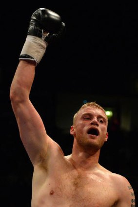 Former England cricketer turned professional boxer Andrew Flintoff celebrates his victory over US boxer Richard Dawson in their heavyweight boxing bout at the Manchester Arena.