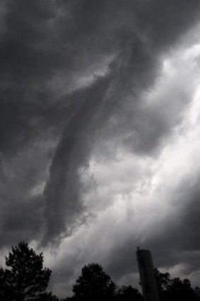 A funnel cloud crosses the town of Louisville, Mississippli on Monday.
