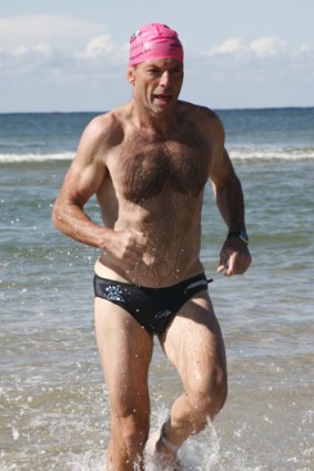 Blue ties and budgie smugglers: Tony Abbott competes in a tram triathlon in 2008.