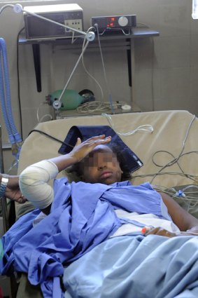 Bahia Bakari, 12, in her hospital bed in the Comoros. Her face is blurred in compliance with the French law protecting minors. 