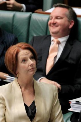 Julia Gillard and Chris Bowen during question time yesterday.