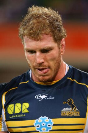 David Pocock of the Brumbies walks from the field after sustaining a knee injury.