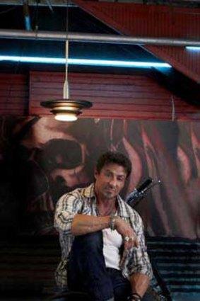 Stallone, 64, in the nostalgia action flick <i>The Expendables</i>, which he wrote and directed.