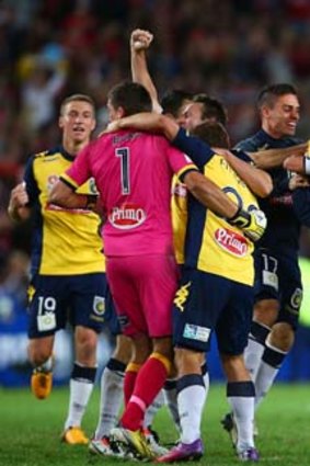 Too classy: Central Coast players celebrate victory against Western Sydney in Sunday's A-League grand final.