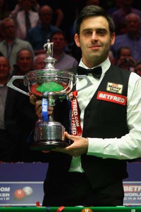 Ronnie O'Sullivan with the trophy after beating Allister Carter of England in the final of the World Snooker Championship in May this year.
