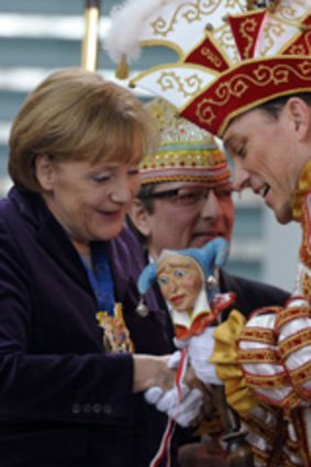 Chancellor Angela Merkel takes a break from tax cheats to launch the country's carnival season in Berlin.