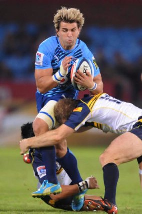 Wynand Olivier tackled by Christian Lealiifano and Pat McCabe during the Super Rugby Round 9 match between Vodacom Bulls and Brumbies from Loftus Versfeld on April 21, 2012 in Pretoria, South Africa.