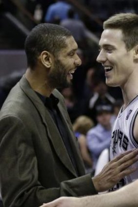 In good company: Australia's Aron Baynes with NBA legend and Spurs great Tim Duncan.