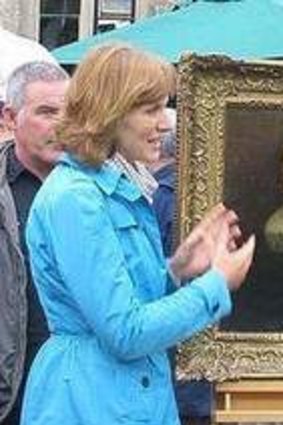 Rich pickings ... Antique Roadshow's Fiona Bruce and Jamie MacLeod with the painting.