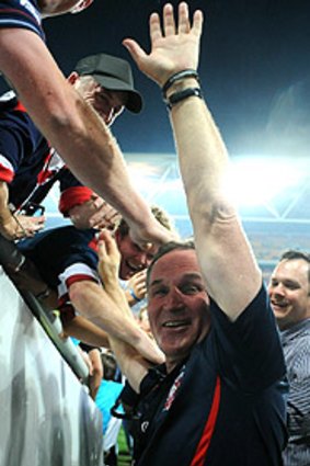 Brian Smith celebrates with fans after the Roosters won their preliminary final.