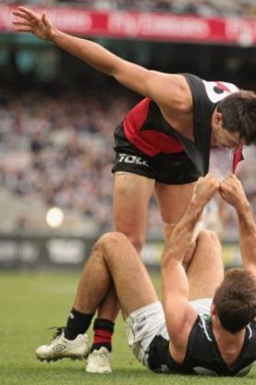 Come here: Bomber Mark Baguley takes a stand against Pie Steele Sidebottom.