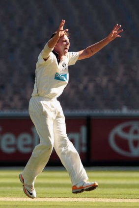 Jake Reed claims the wicket of Ed Cowan.