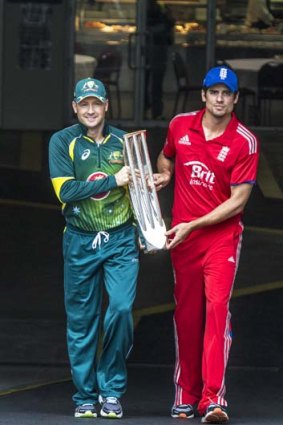 It's mine: Michael Clarke and Alastair Cook with the spoils.