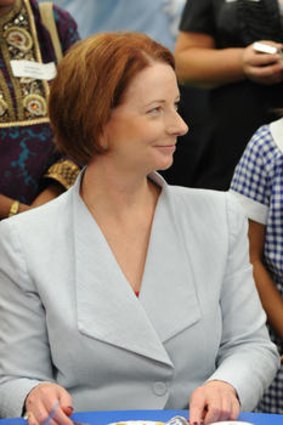 Prime Minister Julia Gillard gets a giggle from school captain Chloe Cortes during a visit to Our Lady of the Rosary Catholic school in Sydney.
