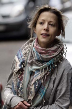 French novelist Tristane Banon leaves her lawyer's office.