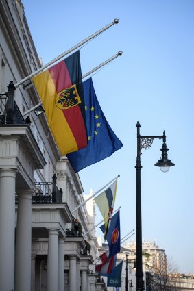 The German flag flies at half-mast with the European Union flag in London.