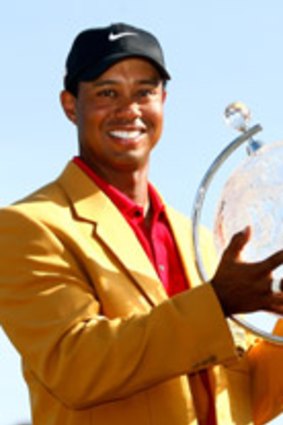 Tiger Woods with his Australian Masters trophy in Melbourne last year.