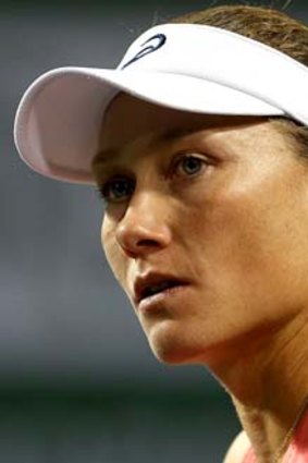 Sam Stosur was forced to hand another German, Angelique Kerber, a quarter-final walkover.