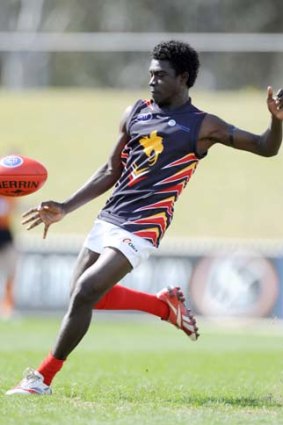 International rules ... Papua New Guinea Mosquitoes forward Brendan Beno in action against France at the AFL International Cup in Blacktown yesterday. A total of 18 teams are competing in the tournament from the Pacific region as well as Canada, Ireland and the USA.