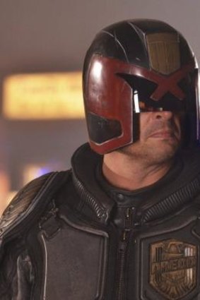 The 2012 version of <i>Dredd</i> features a permanently visored Karl Urban as an unyielding lawmaker.