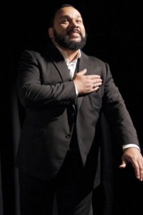 Controversial French humorist Dieudonne M'bala M'bala gestures as he delivers a speech prior to the screening of his movie <i>Antisemite</i> (Anti-Semitism).