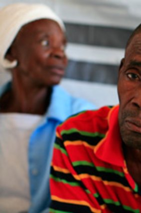 A Haitian man with cholera waits to receive treatment at a clinic set up by the International Red Cross in Port-au-Prince.