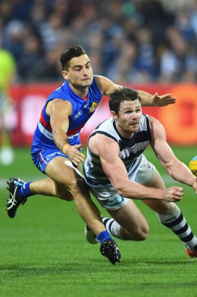 Patrick Dangerfield gets off a handball in a high-pressure match the Geelong star imposed himself on.