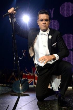 Robbie Williams hams it up on stage in Brisbane.
