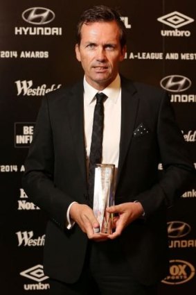 Mike Mulvey with his A-League coach-of-the-year award on Monday night.