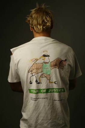 The "Year of Justice" T-shirt worn by St John's students shows an eagle (the college symbol), which is blindfolded and vomiting.