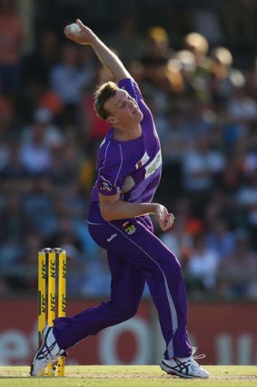 Purple patch: Doug Bollinger winds up for Tasmania.